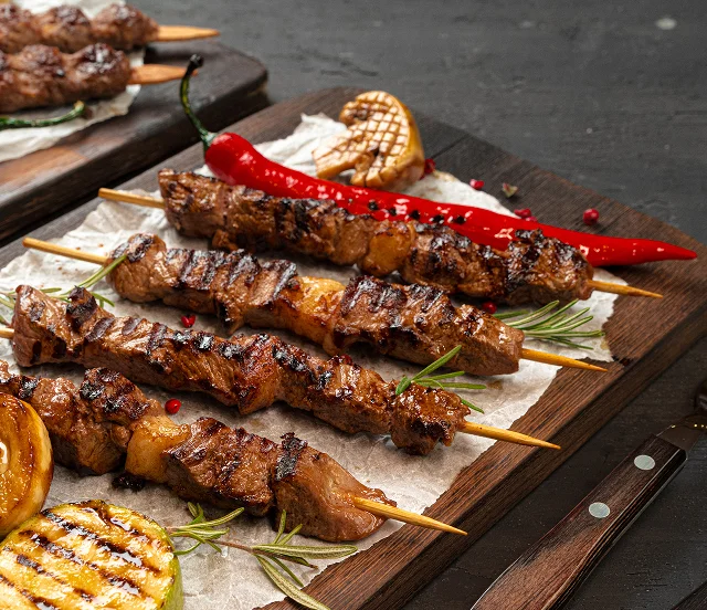 grilled-meat-skewers-barbecue-served-board 2