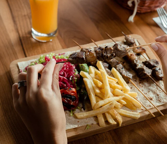 lamb-tikka-kebab-bamboo-skewers-served-with-fries-pickled-cabbage-salad 1